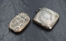 A late Edwardian silver vesta case, of square form having decorative floral engraving with a central