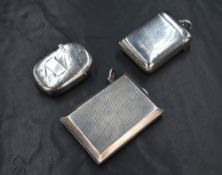 A George V silver vesta case, of hinged rectangular form having engine turned decoration, marks