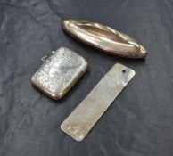 A late Victorian silver vesta case, having scroll decoration, along with a silver bookmark having '