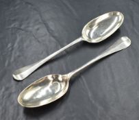 A pair of George III silver Hanoverian pattern serving spoons, having 'TB' to the reverse of the