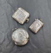 A late Edwardian silver vesta case, of curved form having floral engraving with a vacant shield