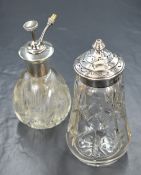 An Elizabeth II silver mounted sugar caster, having a pierced finial topped cover over the cut glass