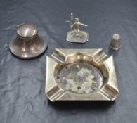 A George V silver inkwell, of traditional circular form, marks for Birmingham 1913, maker Boots Pure