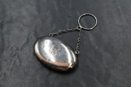 A George V silver snuff box, of hinged oval form engraved 'CL D.T.' the cover with a locket