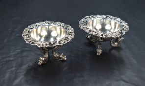 A pair of 'Hanau silver' white metal salts, of circular form having pierced flared rims depicting