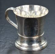 A George V silver tankard, of traditional form having a slightly flared rim, c-curve handle,