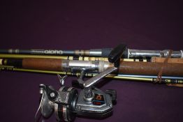 Four fibreglass spinnning rods one with a Daiwa A-400RL reel attached