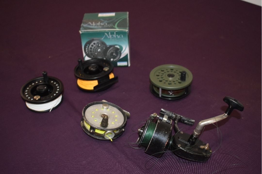 A Shakespeare Alpha fly reel in box with spare spool and 3 other vintage reels