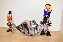 A large mid-century Murano style art glass fish, having multicoloured striped body and clear glass