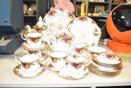 A Royal Albert bone China tea service of lobed globular form, decorated the in the Old Country Roses