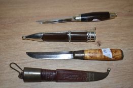 A late 19th century Norse Puukko hunting knife with tooled leather sheath, the steel blade decorated