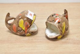 A pair of unusual vintage Japanese ceramic ash trays in the form of a whale, hand painted on a brown