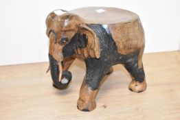 A little flat top hand carved elephant table / stool, h21cm x d26cm