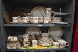 A large mid 20th century Crown Clarence Staffordshire tea service, decorated with brown patterns
