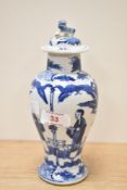 A 19th century Chinese blue and white lidded baluster vase, the lid with foo dog finial, the body