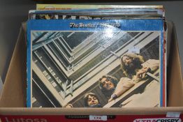 A box of 12' vinyl albums, to include The Beatles/1967-70, The Beatles/1962-66, A Tapestry of