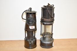 Two early 20th century Patterson minor lamps, largest 28cm.