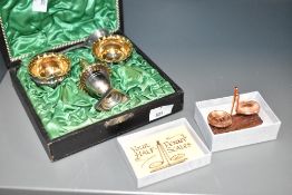 A vintage condiment set, having gilded interiors, to include salt spoons, pepperettes, a pair of