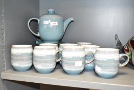 A set of 8 Denby coffee mug's, decorated in the Azure Coast pattern, makers mark to base, sold
