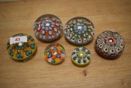 A group of 6 multicoloured Millefiori glass paperweights, largest 8cm. Condition report: Damage