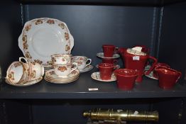 A Royal Albert Crown China part tea service, hand coloured in foliage on an ice white ground, makers