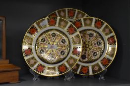 A set of three Royal Crown Derby Bone China plates, hand coloured and printed in the 1128 Imari