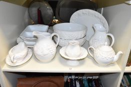 A late 20th century St Michael part tea / dinner service, having a textured foliage pattern on a