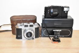A box containing various vintage cameras, to include an Olympus A11, a Balda Koda Chrome 64 and an