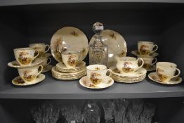 An Edwardian cut glass decanter and white metal spirit label, measuring 24cm high, together with a