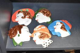A group of mid-century Moorland Staffordshire pottery portrait plaques in the Art Deco style, hand