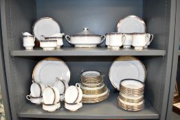 A Royal Albert Fine Bone China dinner service, decorated in the Paragon Sandringham pattern,