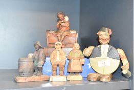 An early 20th Century novelty bottle opener and holder, modelled as a rotund man wearing a fez and