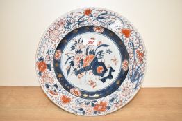 A 18th / 19th century Chinese porcelain plate, decorated in the Imari pattern, having blue and red