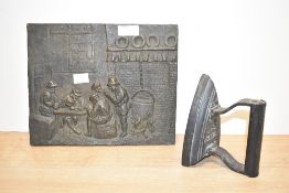 A heavy cast iron plaque depicting a 19th century kitchen scene, h21cm, sold together with a 5''