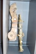 A late 19th / early 20th century table top cast brass cannon, mounted on a wooden wheeled
