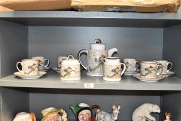 A mid / late 20th century Japanese tea service, hand painted with peacocks in the Chinoiserie style,