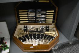 An Art Deco style Silver plated canteen, makers mark 'Viners Ltd', oak cased with key, width 44cm