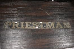 A late 19th / early 20th century metal sign depicting the name 'PRIESTMAN'. *we believe Priestman