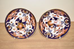 A pair of 19th century Royal Crown Derby porcelain saucers, decorated in the Imari style pattern,