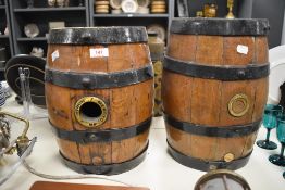 A pair of early 20th century oak cider barrel/kegs, bound with coopered iron, stamped Merry Down