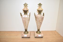 A nice pair of late 19th / early 20th century French Empire clock garnitures in pink marble with