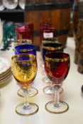 A set of 6 Waterford style cranberry cut crystal champagne glasses, h17cm, sold together with a