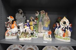 A selection of Staffordshire pottery flatbacks, to include a large figure of a married couple,