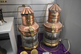 A pair of early 20th century brass maritime ship's port lantern's, having a bow-fronted form with