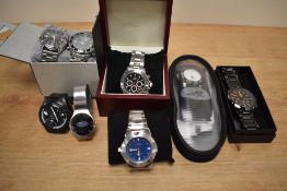 A collection of wristwatches, including Ford, Curren, Reebok and Dunlop, etc