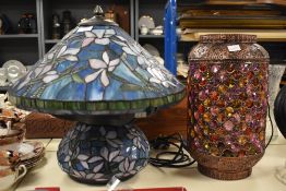 A large mid-century Tiffany style table tamp, having blue, lilac and green floral decoration,