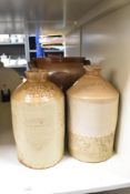 A pair of early 20th century stoneware jugs, impressed makers mark for 'W. Wilson Grocer, Kendal'