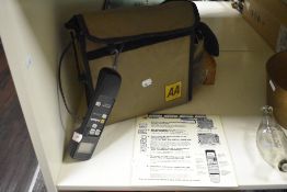 An AA Callsafe Emergency service telephone with instruction and original velcro case, 24cm x 27cm.