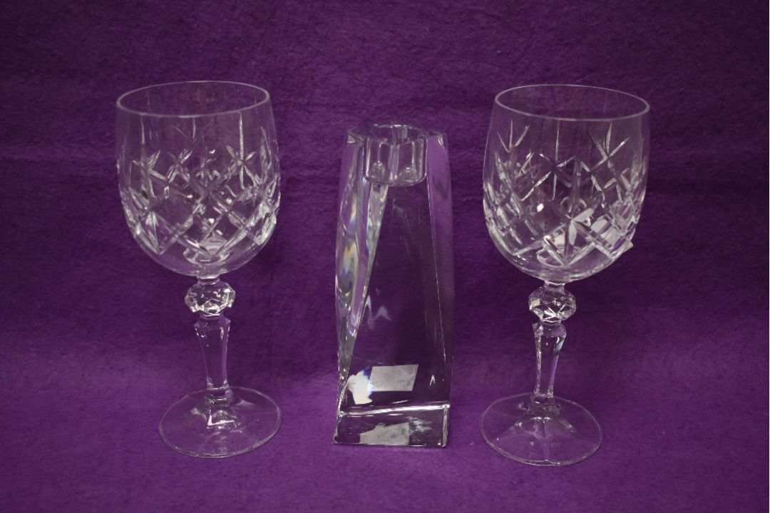 A Swedish Orrefors glass candle holder in the Tornado design, measuring 16cm high, together with a