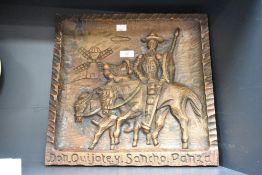 A Spanish folk art solid wooden plaque, the carving depicting Don Quixote and Sancho Panza, h39cm